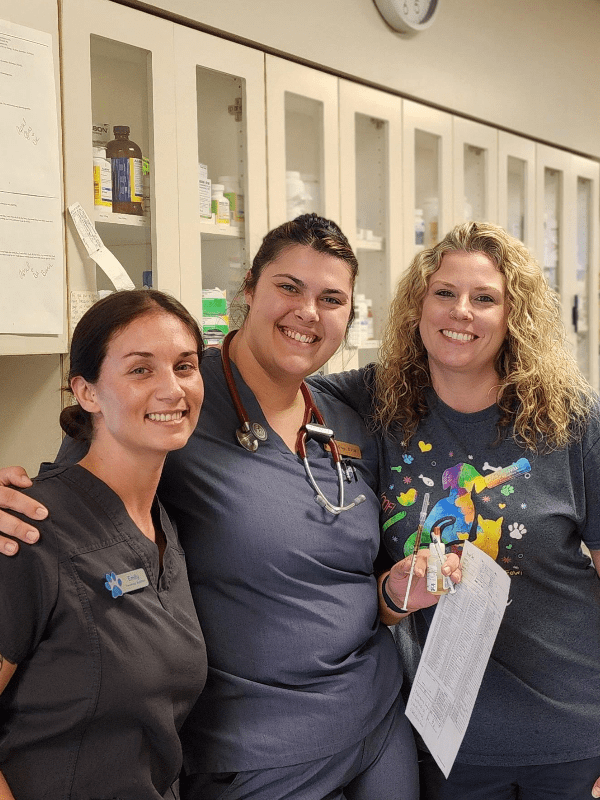 3 female staff members posing for group picture